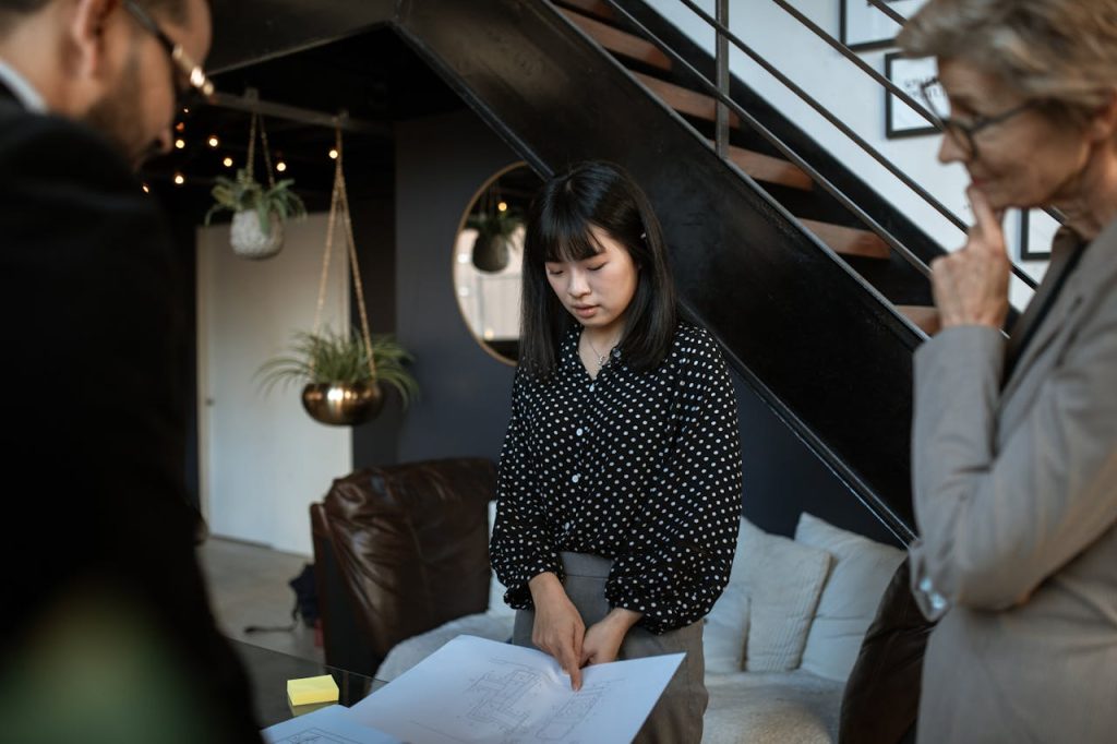 Mastering the First Impression: Your intriguing post title goes here Professional team discussing project plans in a modern office environment.