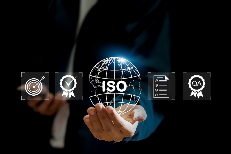 businessman iso symbol showing quality assurance on virtual screen